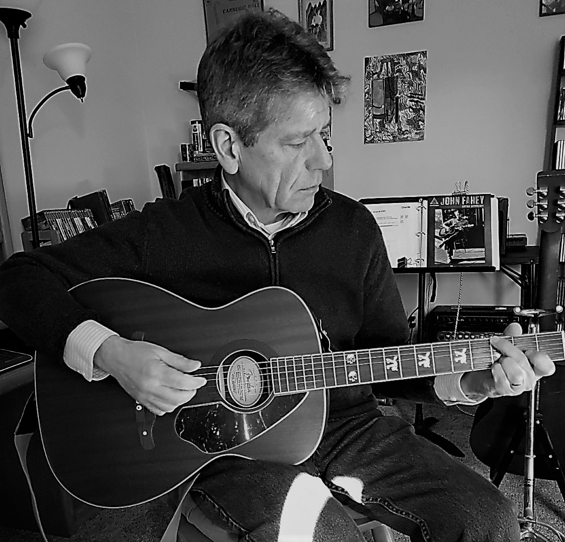 Jerry Callahan, playing a guitar.